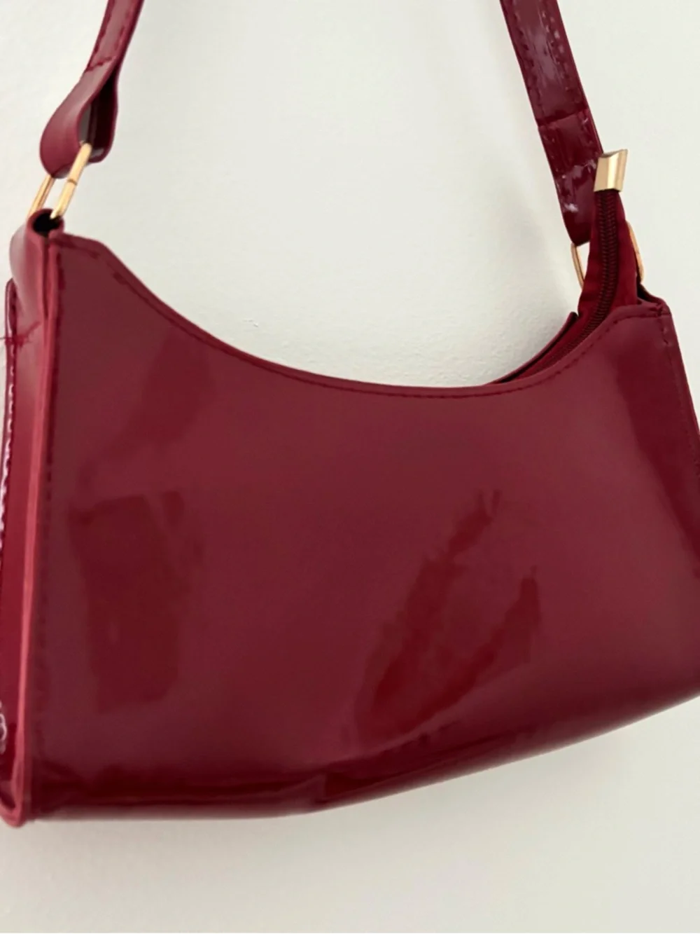burgundy shoulder bag with gold zipper